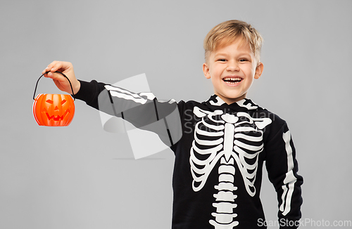 Image of happy boy in halloween costume with jack-o-lantern