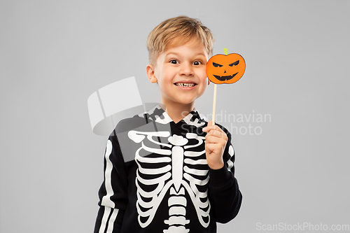 Image of happy boy in halloween costume with jack-o-lantern