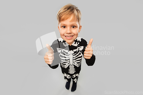 Image of boy in black halloween costume showing thumbs up