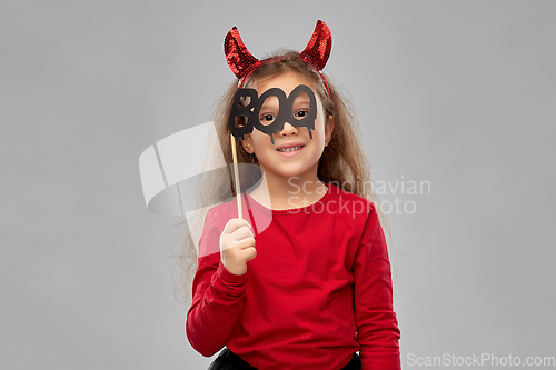 Image of girl in halloween costume with party accessory