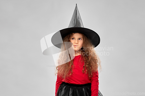 Image of girl in black witch hat on halloween