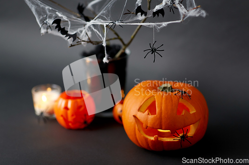 Image of pumpkins, candles and halloween decorations