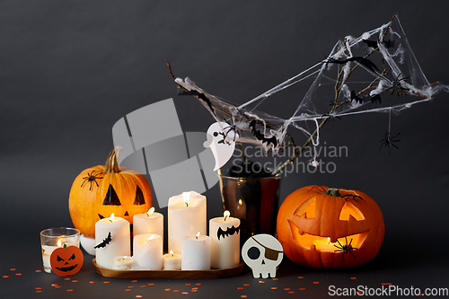 Image of pumpkins, candles and halloween decorations