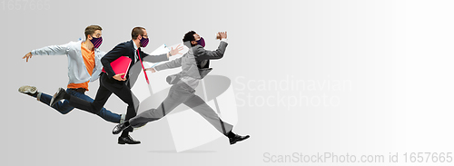 Image of Happy office workers in face masks jumping and dancing in casual clothes or suit isolated on studio background. Creative collage.