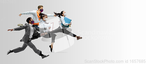 Image of Happy office workers in face masks jumping and dancing in casual clothes or suit isolated on studio background. Creative collage.