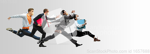 Image of Happy office workers in face masks jumping and dancing in casual clothes or suit isolated on studio background. Creative collage.