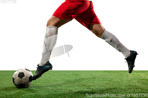 Image of Close up legs of professional soccer, football player fighting for ball on field isolated on white background