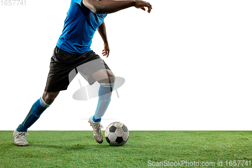 Image of Close up legs of professional soccer, football player fighting for ball on field isolated on white background