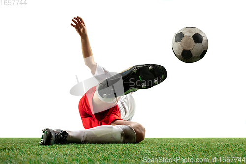 Image of Close up legs of professional soccer, football player fighting for ball on field isolated on white background