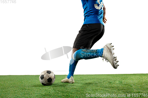 Image of Close up legs of professional soccer, football player fighting for ball on field isolated on white background