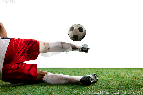 Image of Close up legs of professional soccer, football player fighting for ball on field isolated on white background