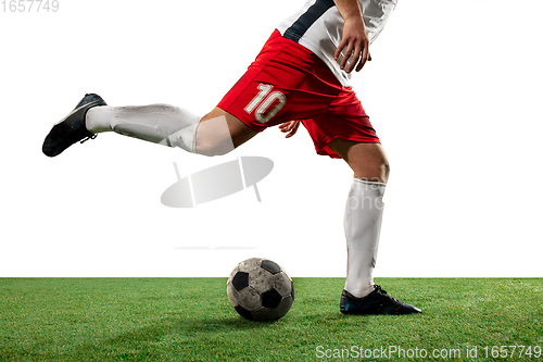 Image of Close up legs of professional soccer, football player fighting for ball on field isolated on white background