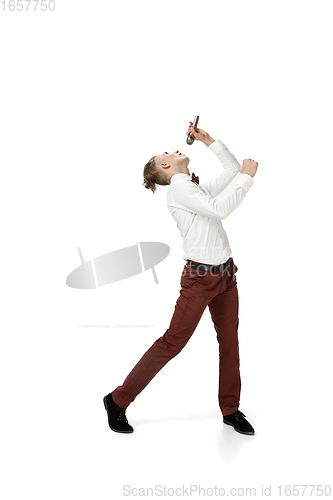 Image of Happy young man dancing in casual clothes or suit, remaking legendary moves of celebrity from culture history