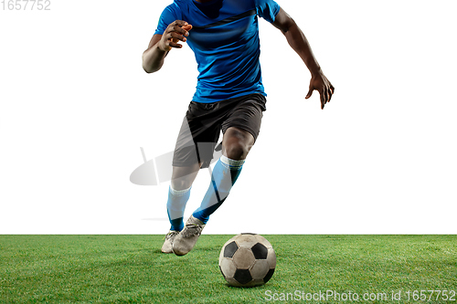 Image of Close up legs of professional soccer, football player fighting for ball on field isolated on white background