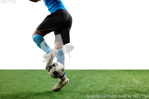 Image of Close up legs of professional soccer, football player fighting for ball on field isolated on white background