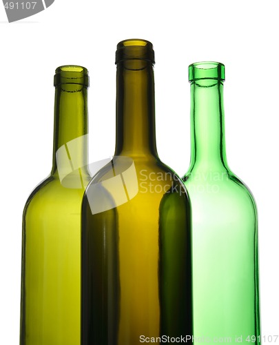 Image of Three empty wine bottles for recycling