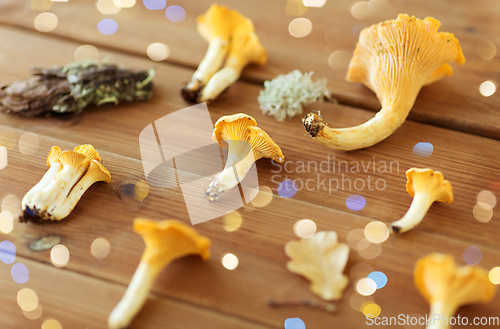 Image of chanterelles on wooden background