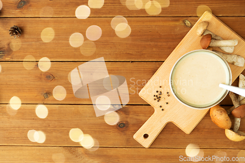 Image of mushroom cream soup in bowl on cutting board