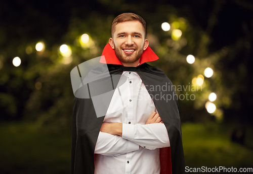 Image of happy man in halloween costume of vampire