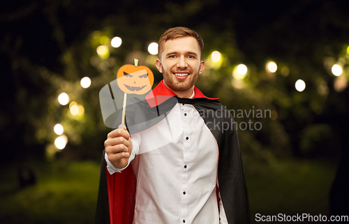 Image of happy man in halloween costume of vampire