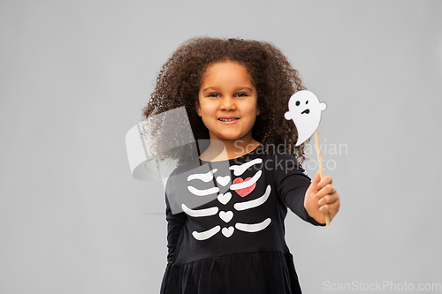 Image of girl in black halloween dress with skeleton bones