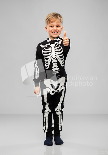 Image of boy in black halloween costume showing thumbs up