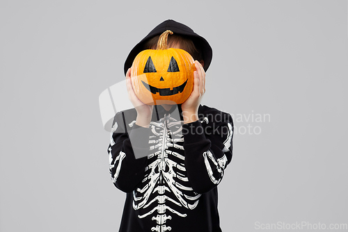 Image of boy in halloween costume with jack-o-lantern