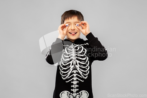 Image of boy in halloween costume of skeleton with eyeballs