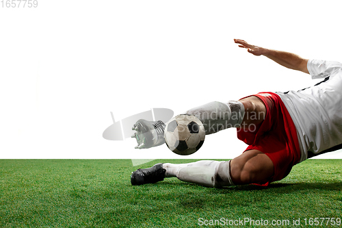 Image of Close up legs of professional soccer, football player fighting for ball on field isolated on white background