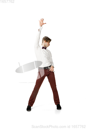 Image of Happy young man dancing in casual clothes or suit, remaking legendary moves of celebrity from culture history