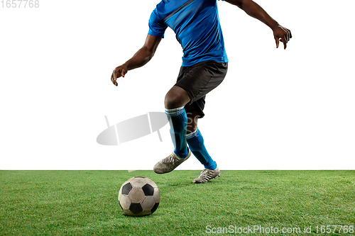 Image of Close up legs of professional soccer, football player fighting for ball on field isolated on white background