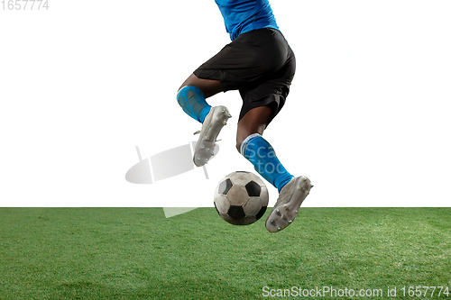 Image of Close up legs of professional soccer, football player fighting for ball on field isolated on white background