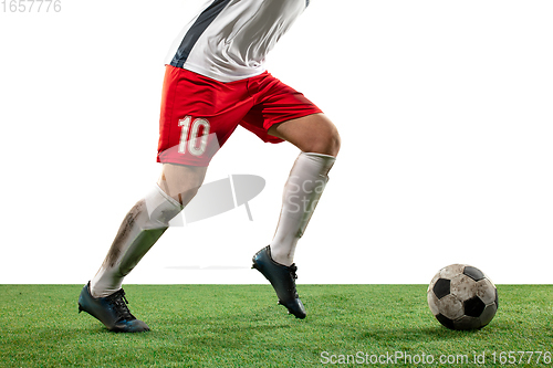 Image of Close up legs of professional soccer, football player fighting for ball on field isolated on white background