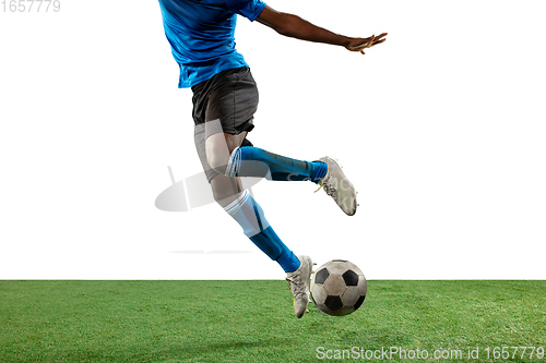 Image of Close up legs of professional soccer, football player fighting for ball on field isolated on white background