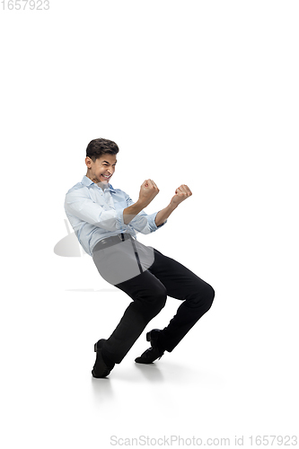 Image of Happy young man dancing in casual clothes or suit, remaking legendary moves of celebrity from culture history