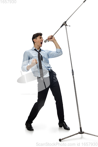 Image of Happy young man dancing in casual clothes or suit, remaking legendary moves of celebrity from culture history