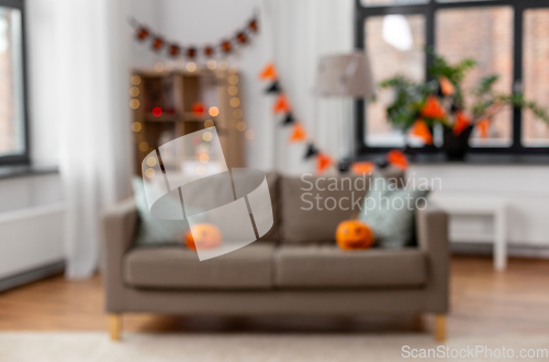 Image of blurred home room decorated for halloween holiday