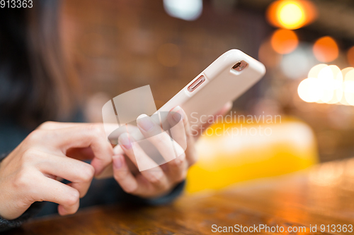 Image of Woman working on cellphone