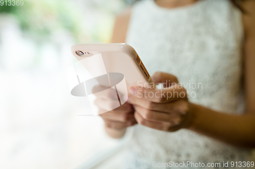 Image of Woman using cellphone