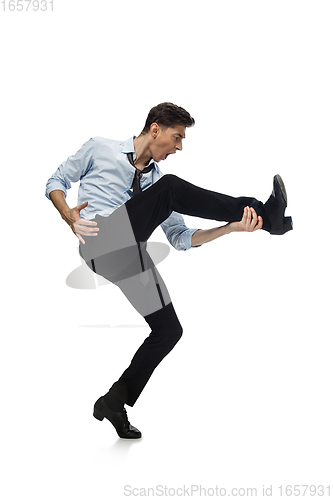 Image of Happy young man dancing in casual clothes or suit, remaking legendary moves of celebrity from culture history