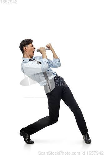 Image of Happy young man dancing in casual clothes or suit, remaking legendary moves of celebrity from culture history