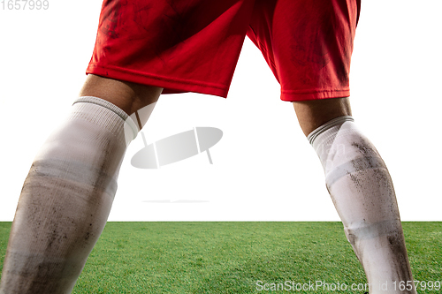 Image of Close up legs of professional soccer, football player fighting for ball on field isolated on white background