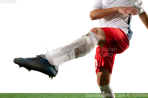 Image of Close up legs of professional soccer, football player fighting for ball on field isolated on white background