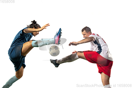 Image of Close up legs of professional soccer, football players fighting for ball on field isolated on white background
