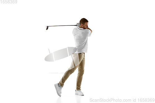 Image of Golf player in a white shirt taking a swing isolated on white studio background