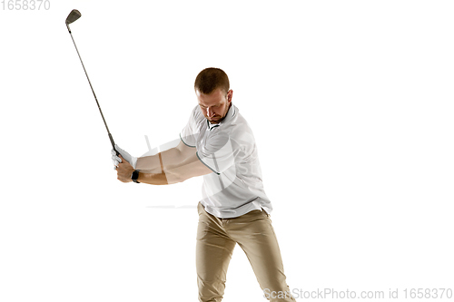 Image of Golf player in a white shirt taking a swing isolated on white studio background