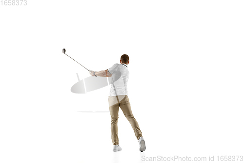 Image of Golf player in a white shirt taking a swing isolated on white studio background