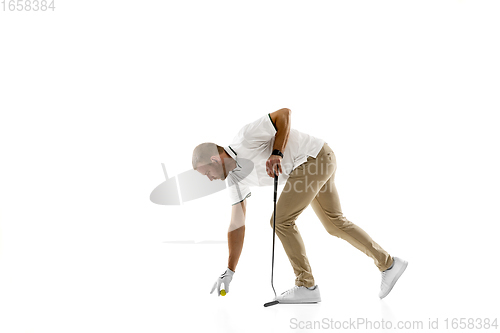 Image of Golf player in a white shirt practicing, playing isolated on white studio background