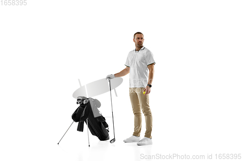 Image of Golf player in a white shirt practicing, playing isolated on white studio background