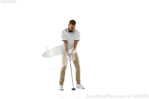 Image of Golf player in a white shirt practicing, playing isolated on white studio background